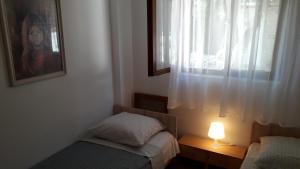 Posteľ alebo postele v izbe v ubytovaní Apartmani Mia