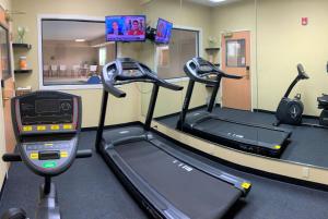 a gym with two treadmills and a treadmill at Baymont by Wyndham Paw Paw in Paw Paw