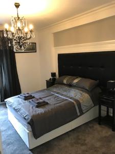 Ένα ή περισσότερα κρεβάτια σε δωμάτιο στο Sandy Pad's Apartments