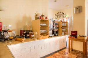 a shop with a counter with vases on it at Clube Porto Mos - Sunplace Hotels & Beach Resort in Lagos
