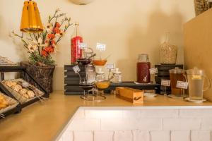 a table with some drinks and vases on it at Clube Porto Mos - Sunplace Hotels & Beach Resort in Lagos
