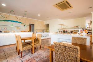 a dining room with a table and chairs at Clube Porto Mos - Sunplace Hotels & Beach Resort in Lagos