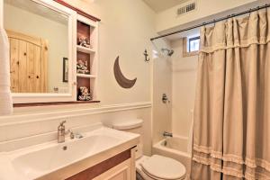 a bathroom with a sink and a toilet and a shower at Mtn-View Cabin w/ Hot Tub in Sevierville! in Sevierville +21 photos