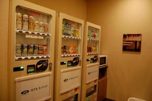 two vending machines in a room with drinks at Hotel Route Inn Kusatsu Ritto -Ritto Inter Kokudo 1 gou- in Ritto