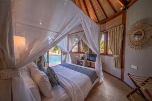 Кровать или кровати в номере Blue Lagoon Avia Villas