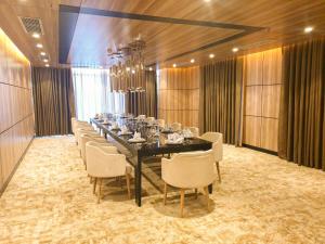 a large dining room with a long table and chairs at Diamond Stars Ben Tre Hotel in Ben Tre +85 photos