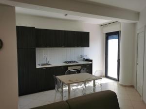 A kitchen or kitchenette at La Maison Latina Guest House