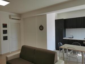 A kitchen or kitchenette at La Maison Latina Guest House