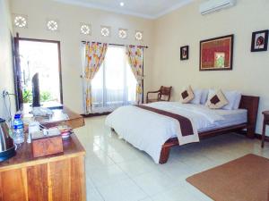Postel nebo postele na pokoji v ubytování Pendopo 45 Resort
