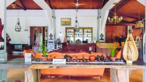 a counter in a room with a table with pumpkins on it at Pendopo 45 Resort in Bogor
