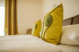 Letto o letti in una camera di Hotel Garni Toscanina - Adults Only