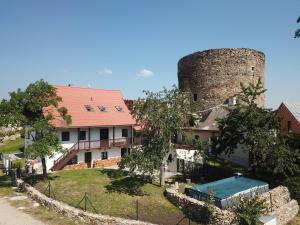 a house and a castle with a swimming pool at Vila Anička Vimperk in Vimperk