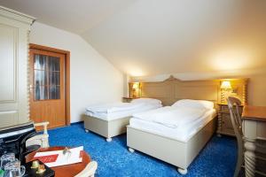 Ένα ή περισσότερα κρεβάτια σε δωμάτιο στο Hotel U Kata
