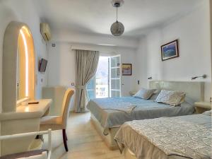 Letto o letti in una camera di Avraki