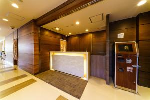 Una televisión o centro de entretenimiento en Super Hotel Fujinomiya