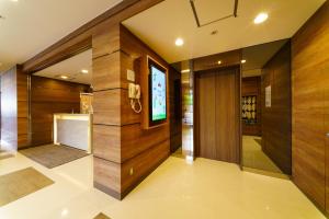 Una televisión o centro de entretenimiento en Super Hotel Fujinomiya