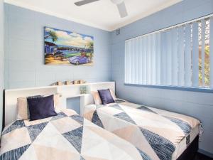 Ένα ή περισσότερα κρεβάτια σε δωμάτιο στο Forster Holiday Lodge 09
