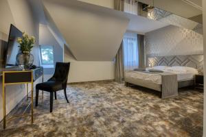 Postel nebo postele na pokoji v ubytování Hotel & Spa Biały Dom