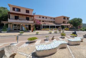 a building with aasteryasteryasteryasteryasteryasteryasteryasteryasteryasteryasteryastery at Baia de Bahas Residence in Golfo Aranci