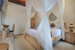 Ein Bett oder Betten in einem Zimmer der Unterkunft Sitala Suite