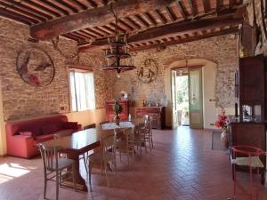 a large living room with a table and chairs at La Calona in Camaiore +40 photos