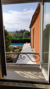 a view from a window of a balcony at Chambre privée tout confort in Conlie