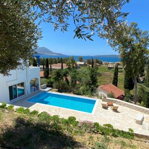 a villa with a swimming pool and a view at Villa Andrea in Gialova