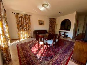 a living room with a table and a couch at casa alla Valle in Salò