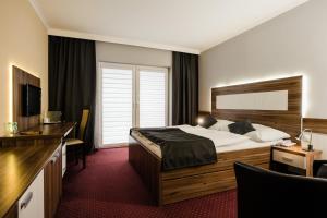 Posteľ alebo postele v izbe v ubytovaní Hotel Menhard