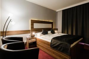 Posteľ alebo postele v izbe v ubytovaní Hotel Menhard