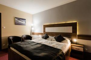 Posteľ alebo postele v izbe v ubytovaní Hotel Menhard