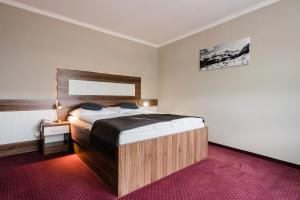 Posteľ alebo postele v izbe v ubytovaní Hotel Menhard