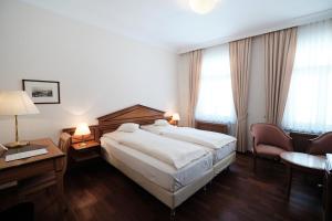 Postel nebo postele na pokoji v ubytování Hotel Weisser Bock
