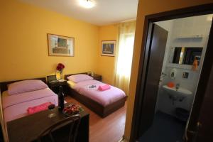 Posteľ alebo postele v izbe v ubytovaní Guest House Vila Micika Dubrovnik
