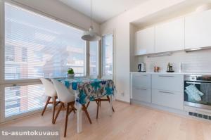 A kitchen or kitchenette at The Best View in Turku with private balcony, sauna, car park