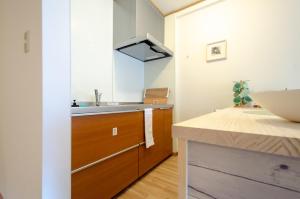 Letto o letti in una camera di 箱館宿 観月-Mizuki-伝統的建築物の宿-最大8名宿泊可能