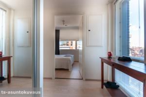 a room with a view of a bedroom at The Best View in Turku with private balcony, sauna, car park in Turku