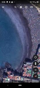 an aerial view of a beach with a wave at Calle Guajara, 1. Casa Playa Chica in Puerto de la Cruz