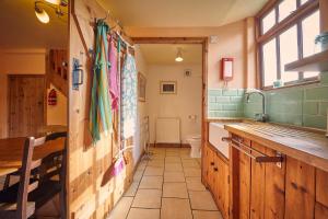 a bathroom with a sink and a toilet at Host & Stay - The Red Brick Barn in Rookhope +15 photos