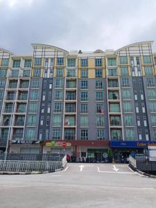 a large building with a parking lot in front of it at Bishops Cap at Cameron Highlands in Brinchang