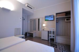 Posteľ alebo postele v izbe v ubytovaní Hotel Vittoria