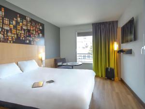 Postel nebo postele na pokoji v ubytování ibis Lyon Sud Vienne Saint-Louis + 37 fotografií