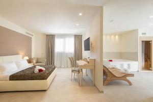 Postel nebo postele na pokoji v ubytování Hotel Giardino Suites&Spa