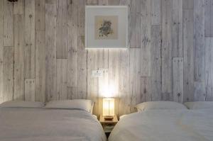 Letto o letti in una camera di 箱館宿 観月-Mizuki-伝統的建築物の宿-最大8名宿泊可能