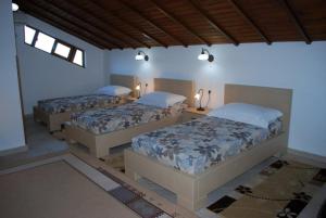 Postel nebo postele na pokoji v ubytování Hotel Boutique Osumi