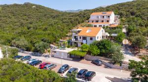 an aerial view of a parking lot with cars at Villa Castello in Korčula