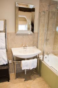 a bathroom with a sink and a shower at The Lion in Leintwardine