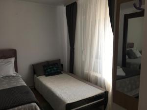 Voodi või voodid majutusasutuse Apartmani Spasić toas