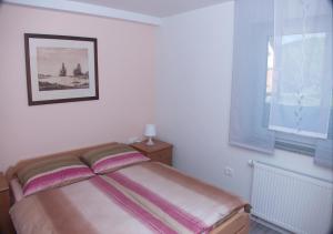 Postel nebo postele na pokoji v ubytování Apartmaji Anita