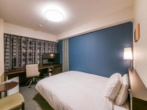 Säng eller sängar i ett rum på Richmond Hotel Fukuoka Tenjin